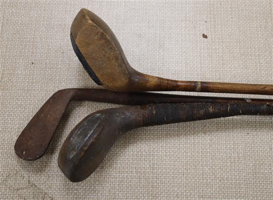 A D. Herd scared-neck bulger driver, c.1895, a L. Searle Elmstead GC hickory shafted driver and a hickory shafted iron